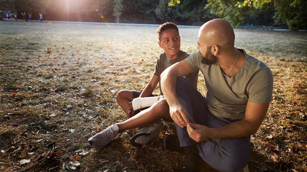 Father and son talking about teen drinking and their household stance proactively