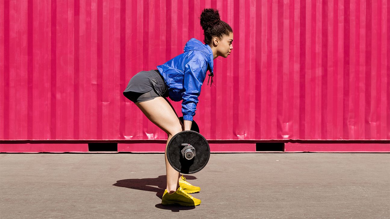 lifting person pink background