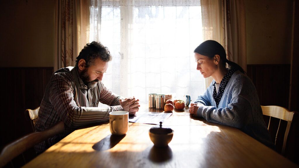 Couple sits down to discuss if one of them is depressed or unhappy in their marriage