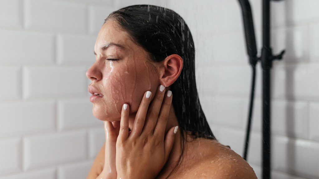 Woman takes hot shower to help her fall asleep