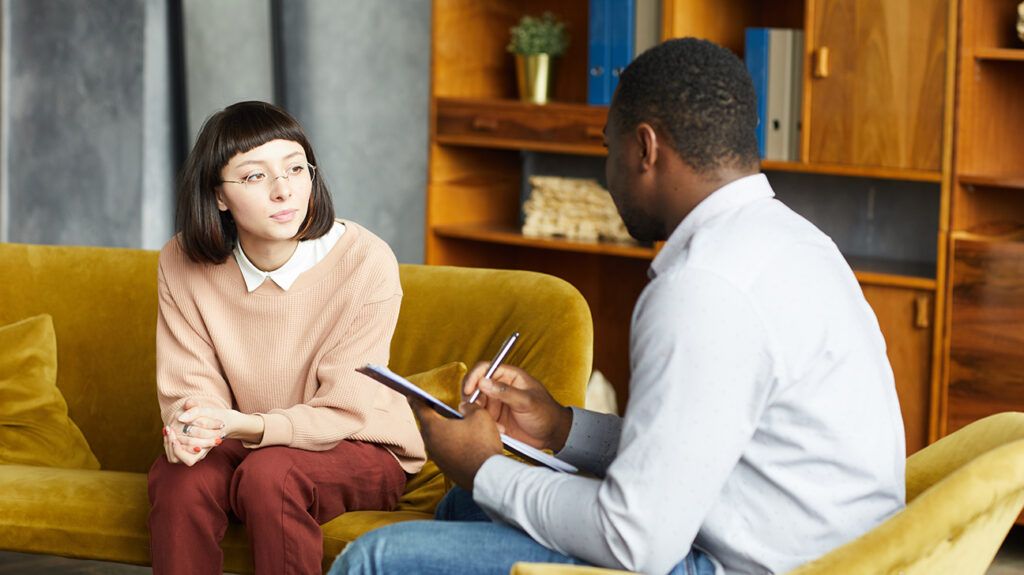 Woman talking with psychologist