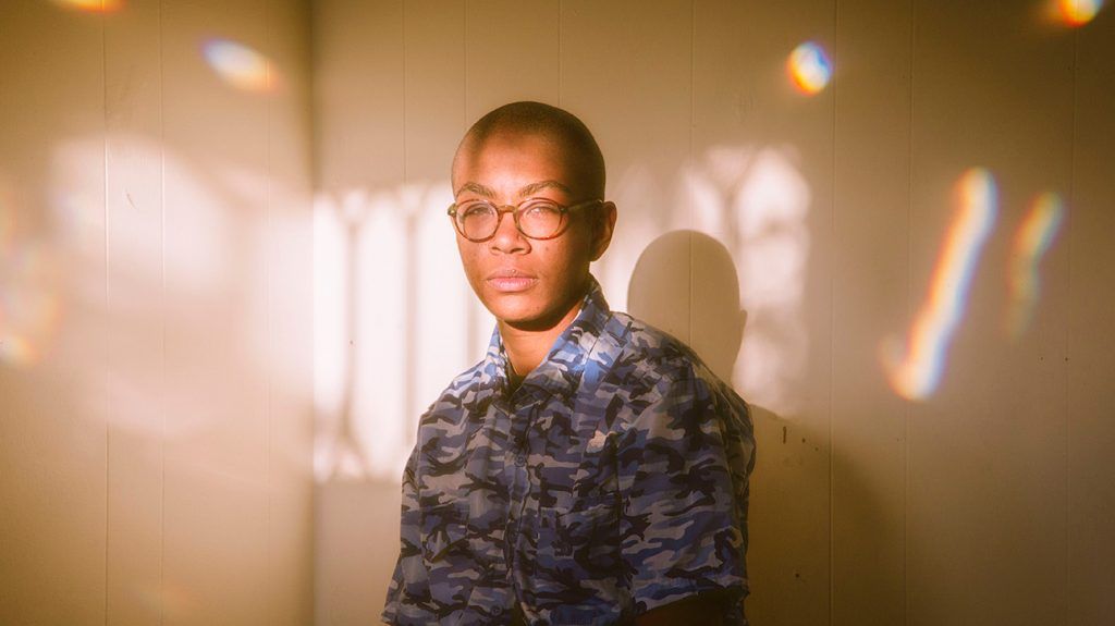 man standing in the sunlight with prisms